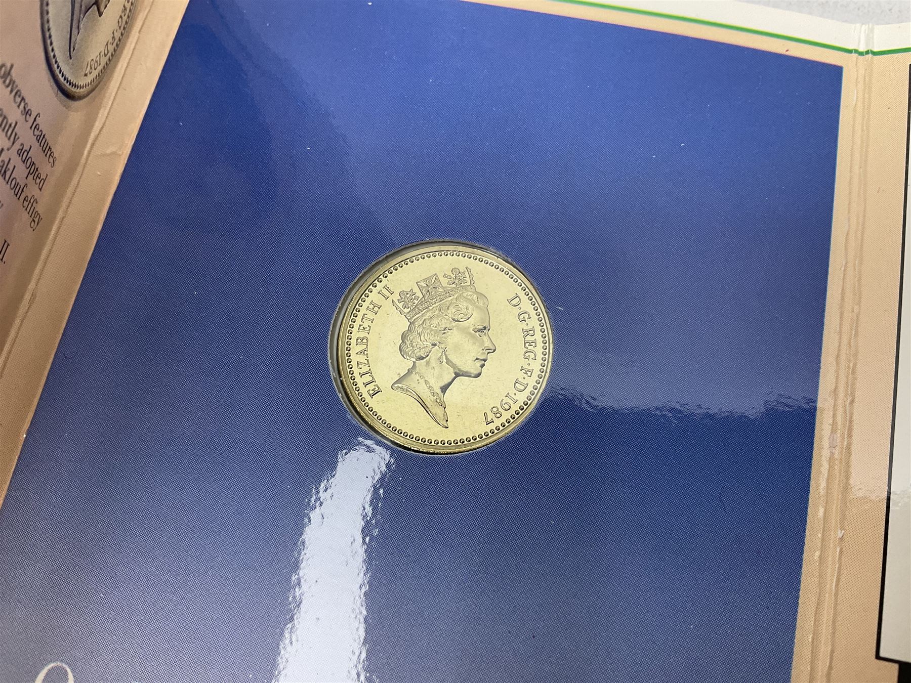 Two Great Britain and Northern Island proof sets dated 1970 and 1971, both with card cases, three 1986 Commonwealth Games commemorative two pound coins, in card folders, and six brilliant uncirculated one pound coins, in card folders