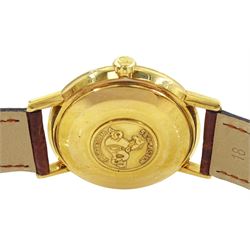 Omega Seamaster De Ville gentleman's 18ct gold automatic wristwatch, Ref. 166020 SC, Cal. 565, silvered dial with baton hour markers and date aperture, stamped 18K, with Helvetia hallmark, on an Omega brown leather strap with Omega gilt buckle