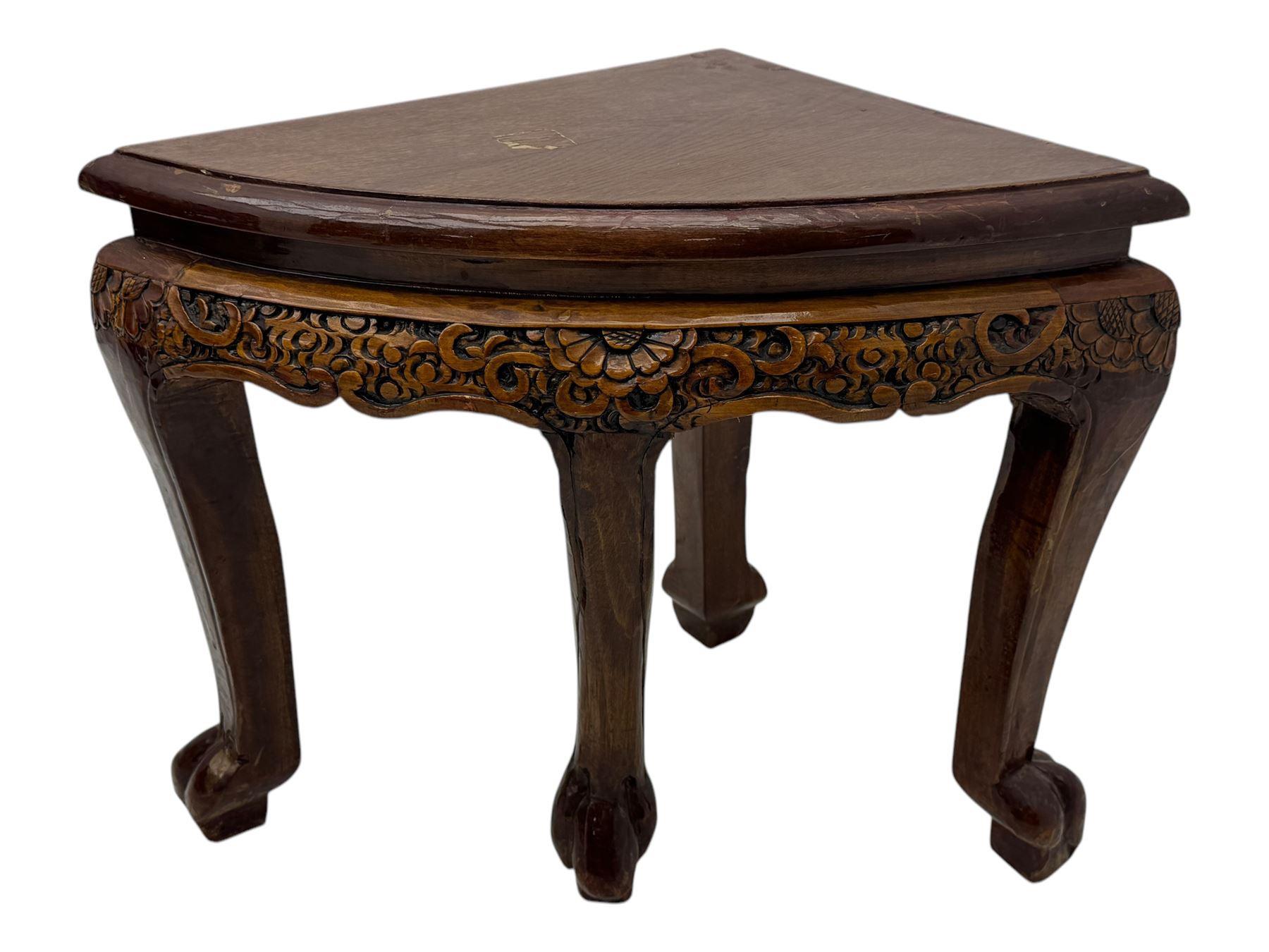 Early 20th century Chinese hardwood nesting coffee table, oval top carved with figures and traditional pagoda scenes with carved frieze, complete with six inset stools or side tables, raised on tapering supports with paw feet