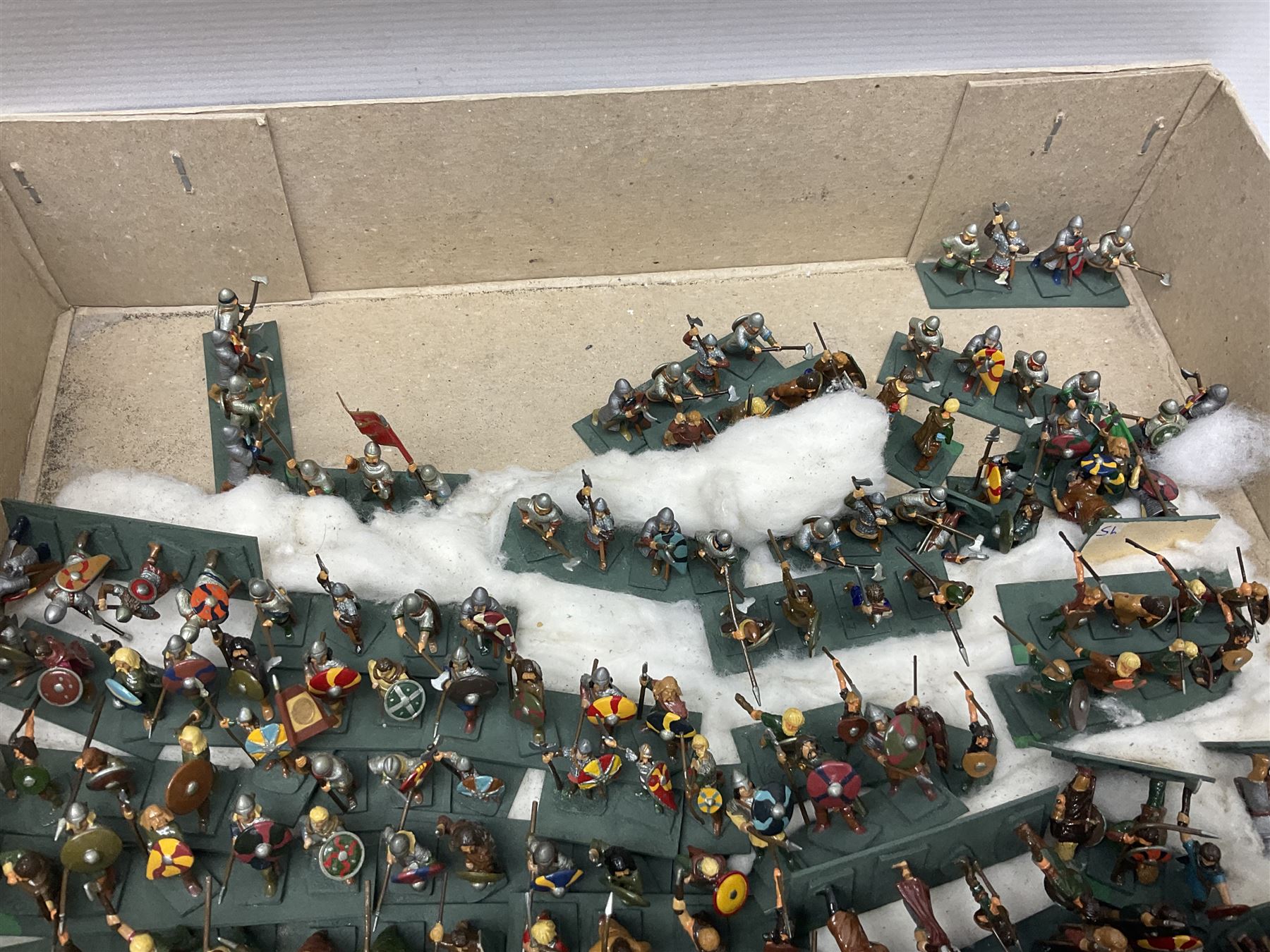 Painted metal wargame figures - over four hundred including Normans and Saxons, Romans, British Tribes etc; together with a quantity of part-painted and unpainted figures, battlefield weapons and accessories etc; average size 25mm