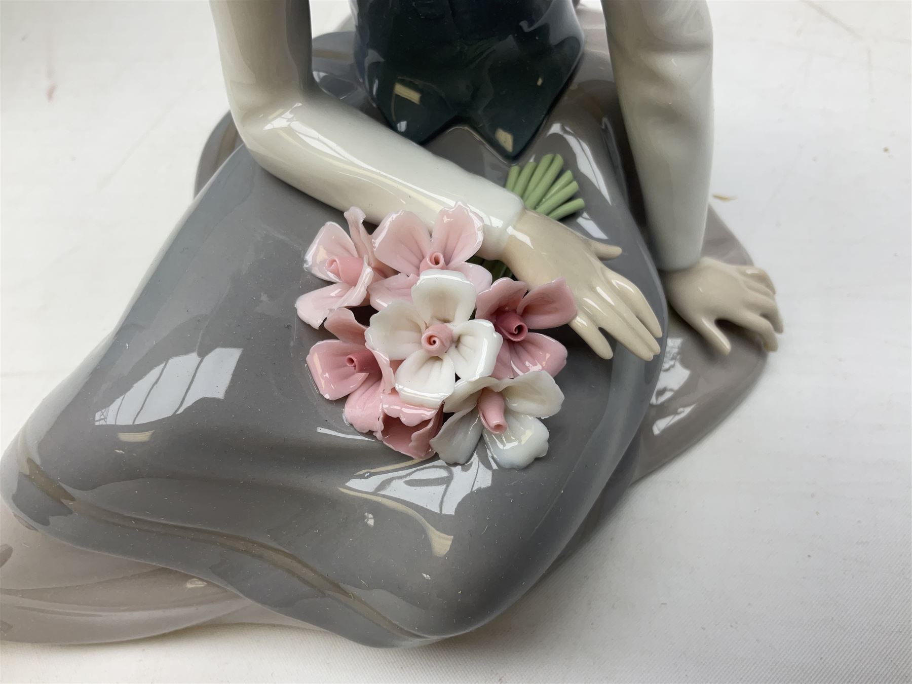 Three Lladro figures, comprising Pondering, no 5173, Nostalgia, no 5071 and Nature's Bounty, no 1417, all with original boxes, largest example H27cm