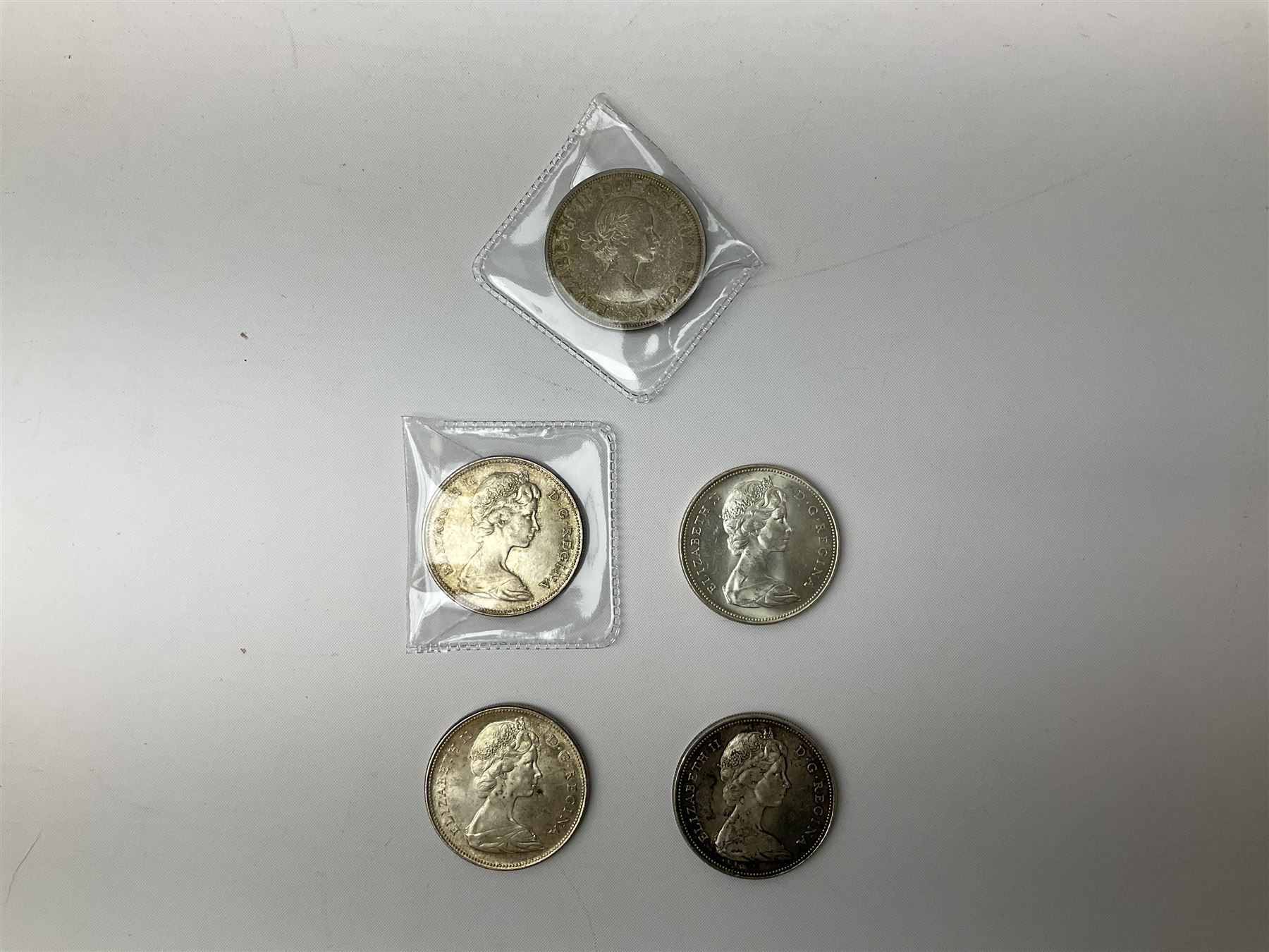 Canadian coinage including Queen Elizabeth II 1964 and four 1966 dollars, 1975 Olympic four coin set comprising two five dollar and two ten dollar coins, 1995 specimen coin set in blue folder, 1995 uncirculated coin set etc 