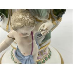 Meissen potpourri vase and cover, for restoration, of baluster form decorated with hand painted panel of a courting couple, and panel of a floral spray, further detailed with hand painted sprigs and encrusted flowers, flanked by two putti, with blue crossed swords mark beneath, H25cm