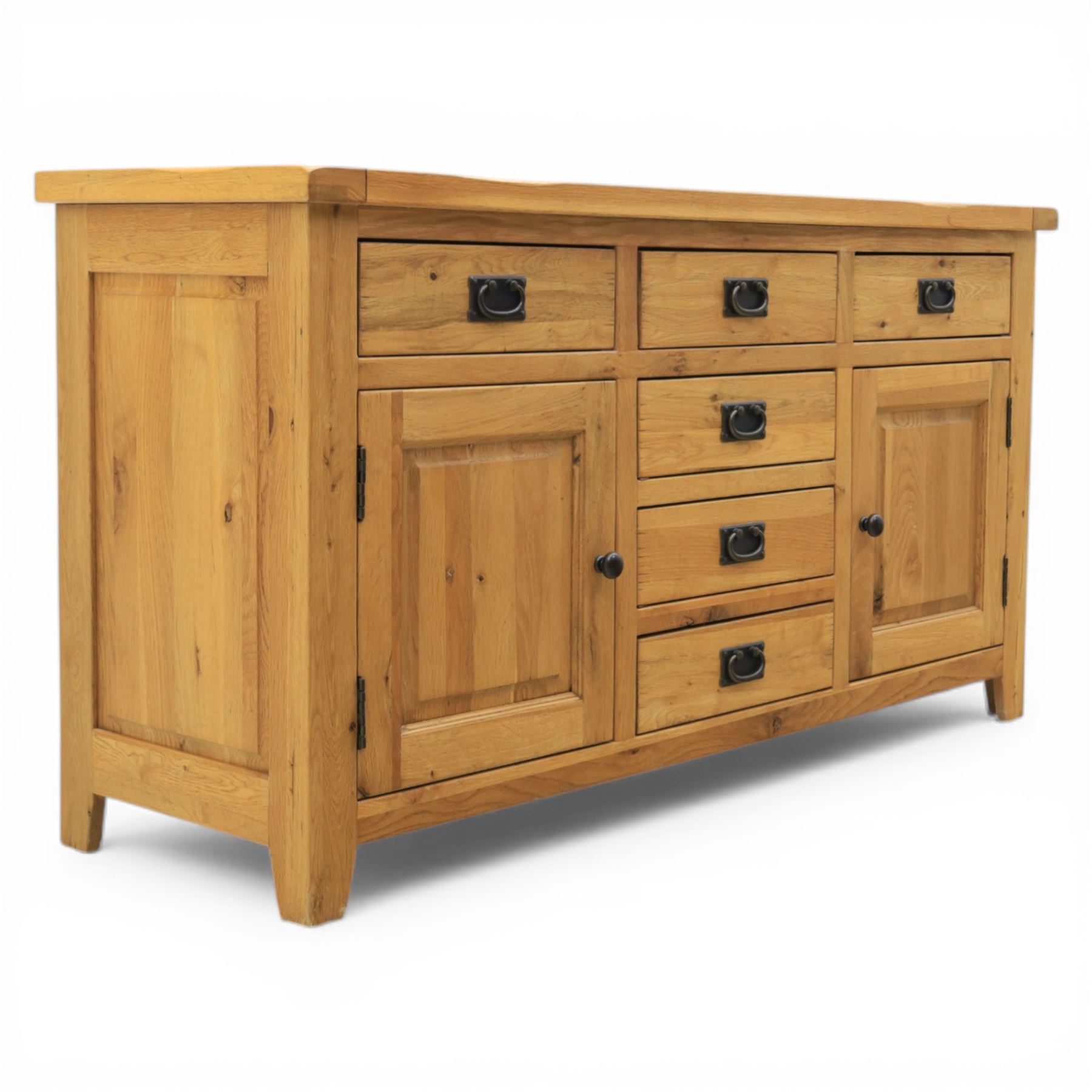 Modern light oak sideboard, fitted with six drawers and two cupboards