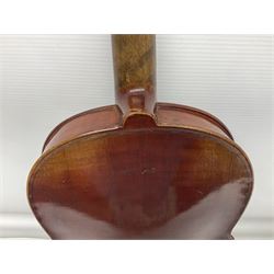 Late 19th century French three-quarter size 'Conservatory' violin with 34cm two-piece maple back and ribs and spruce top, the peg box inscribed 'Conservatory Violin Straduari', bears label 'Antonius Stradiuarius Cremonensis Faciebat Anno 1721' L55.5cm overall; in ebonised wooden 'coffin' case; and Saxony violin c1900 with 36cm two-piece maple back and ribs and spruce top; bears label 'Antonius Stradivarius Cremonensis Faciebat Anno 17**' L59cm overall; in carrying case (2)