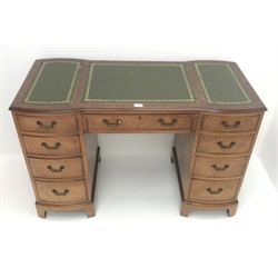  Mid 20th century walnut twin pedestal desk, three piece inset leather top, nine drawers, shaped plinth base, W117cm, H76cm, D85cm  