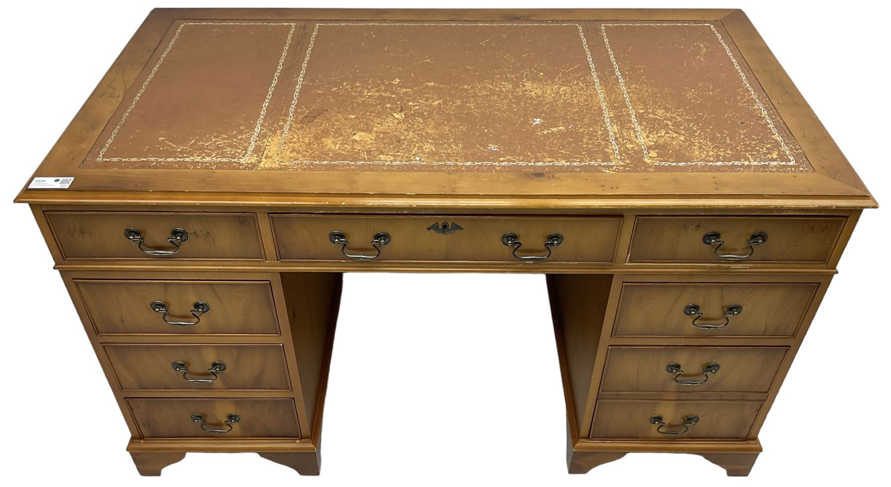Georgian design yew wood twin pedestal desk, moulded rectangular top over nine cock-beaded drawers, on bracket feet