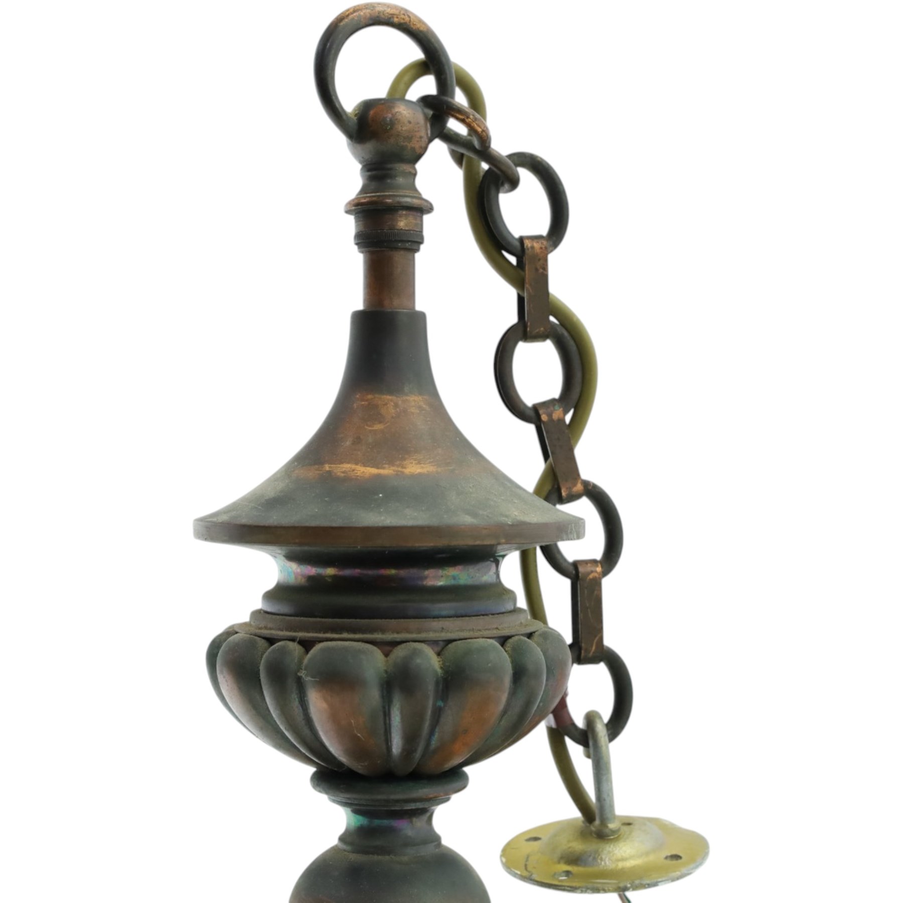 Art Nouveau copper three branch chandelier, turned central column with foiliate collar, issuing three scrolling strapwork arms, fitted with cut glass pendant shades, suspended from a chain
