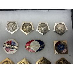 Twenty-six Russian Soviet Space badges 1960s/70s; in small display case