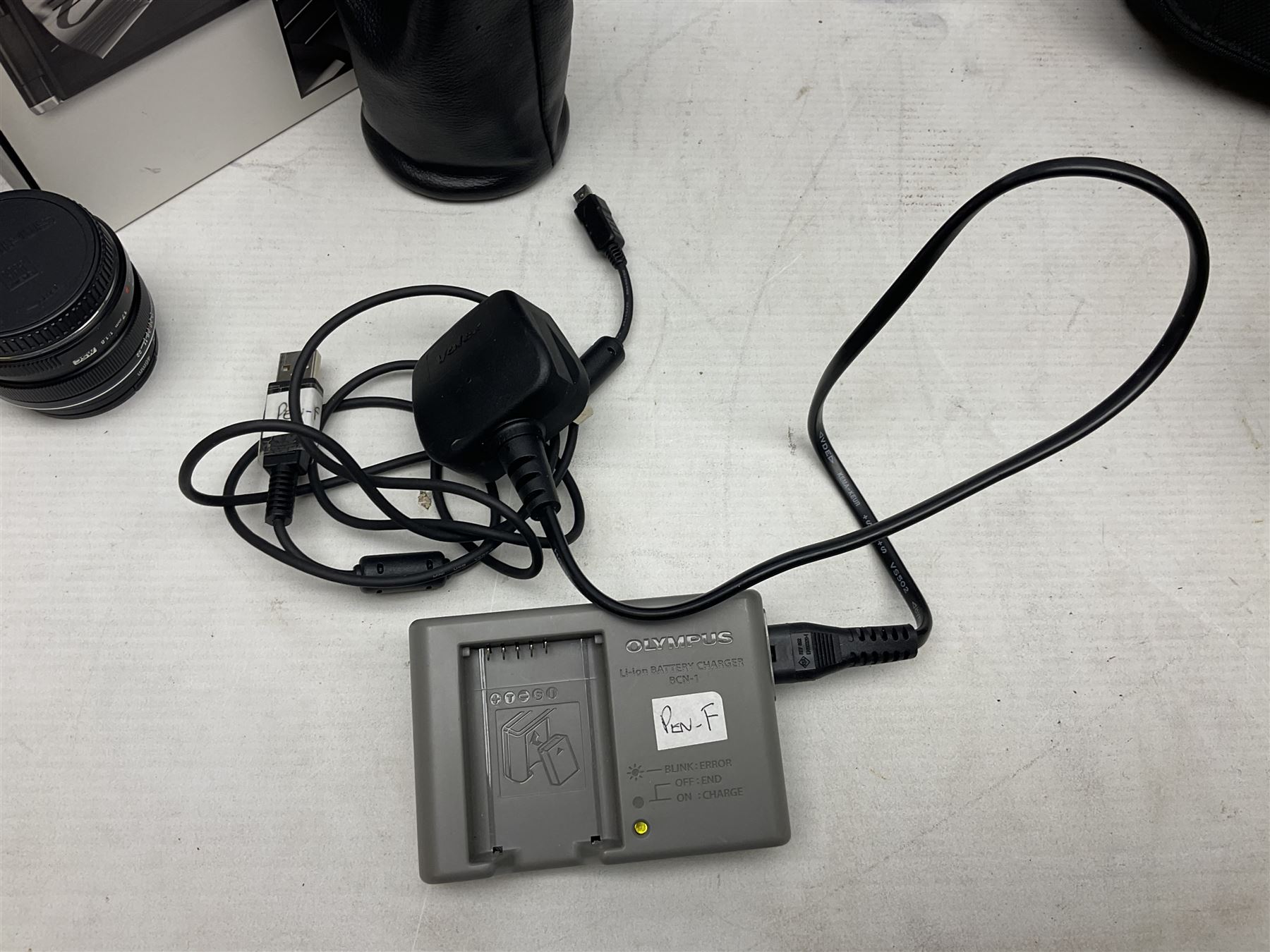 Olympus PEN-F camera body, with 'Olympus M- Zuiko Digital 25mm 1: 1.8' lens,  'Olympus M- Zuiko Digital 75-300mm 1: 4.8 - 6.7' lens and  'Olympus M- Zuiko Digital 17mm 1: 1.8' lens, with original box, together with Lowepro camera bag