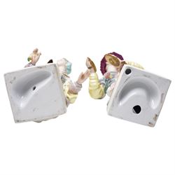 Pair of Continental polychrome Chinese male and female standing figures wearing floral robes H42cm