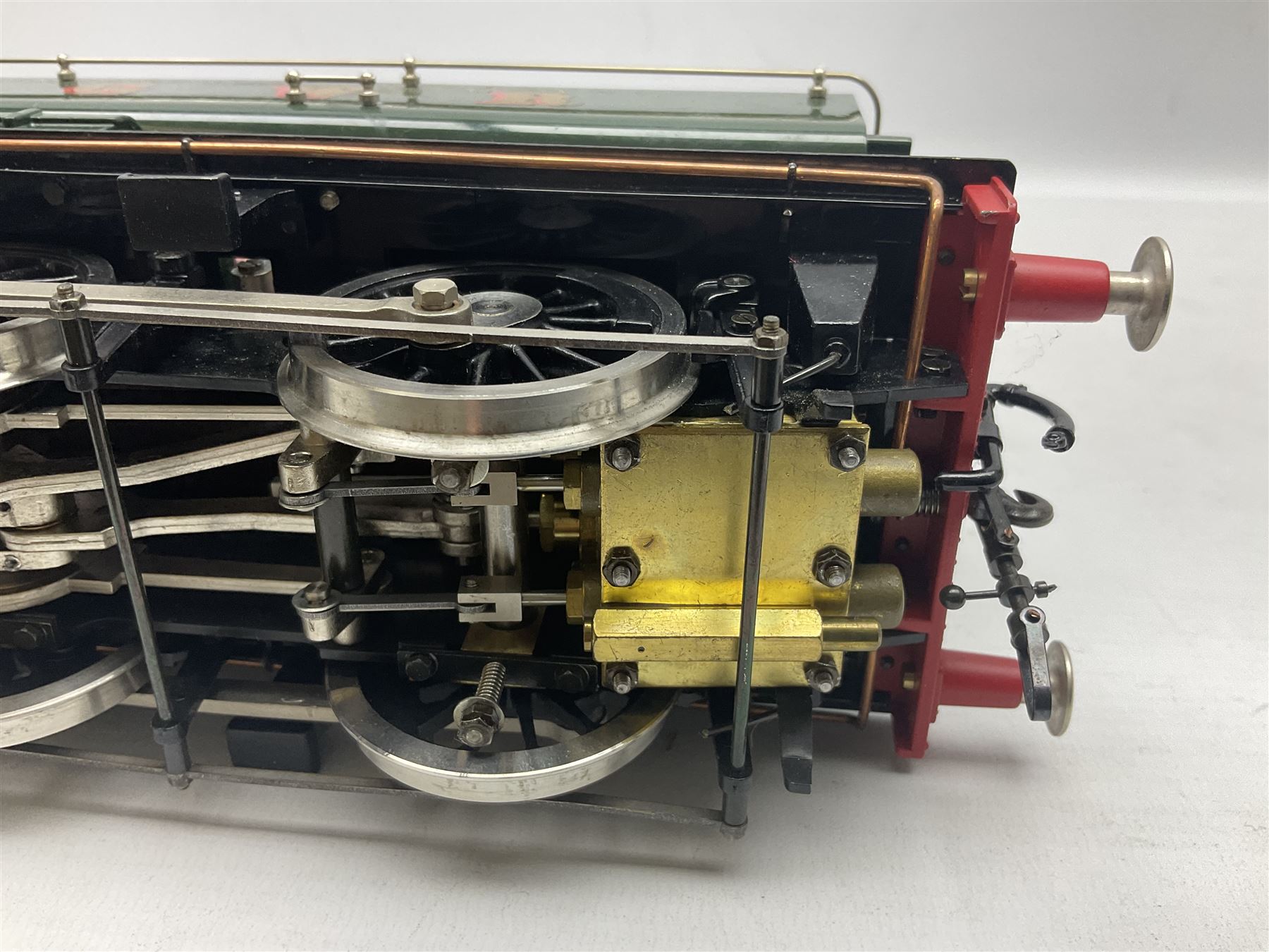 Gauge 1 - Aster 0-6-0 Great Western Railway Pannier tank locomotive No.6752; spirit fired and live steam powered with fitted steam pressure gauge, water sight glass and other usual fittings; finished in Great Western Railway green livery with GWR initials to the pannier tanks, fitted steps, handrails, checker plate, lamp irons, buffers and vacuum hoses; L31cm W8.5cm
