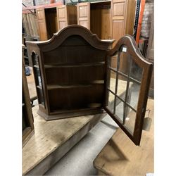 Dutch design oak wall hanging apothecary cabinet, of arched form with single astragal style glazed door enclosing single shelf (W69cm D18cm H69cm); together with another similar of corner form (W75cm D48cm H69cm) - THIS LOT IS TO BE COLLECTED BY APPOINTMENT FROM THE OLD BUFFER DEPOT, MELBOURNE PLACE, SOWERBY, THIRSK, YO7 1QY