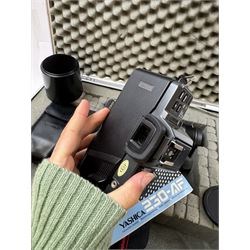 Yashica 230-AF camera outfit, including camera body serial no. 0184693, three Yashica lenses comprising AF 70-200mm 1:4.5 serial no. F6162003, AF 28-85mm 1:3.5-4.5 macro lens serial no. F6225564 and an AF 75-300mm 1:4-5.6 Macro lens serial no. F7100913, flash, hood and other accessories and instruction booklet, contained within a silver flight case 