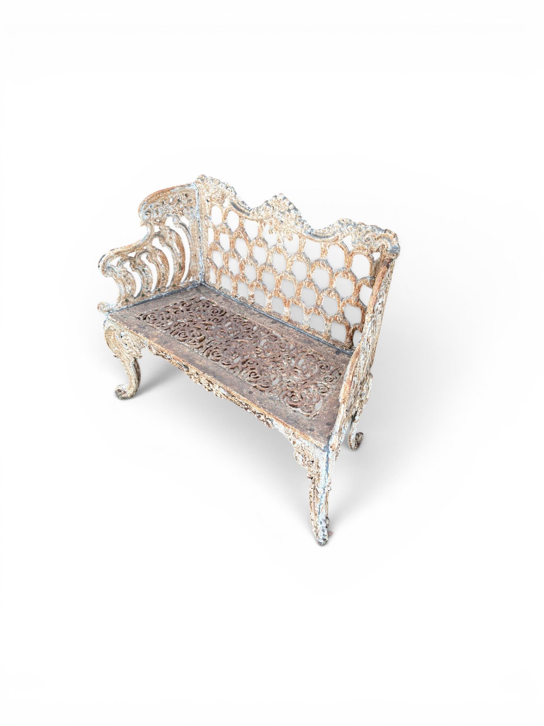 Victorian revival Carron Foundry design heavy cast iron two seat garden bench, scrolled arms with pierced lattice seat, finished in antique white paint