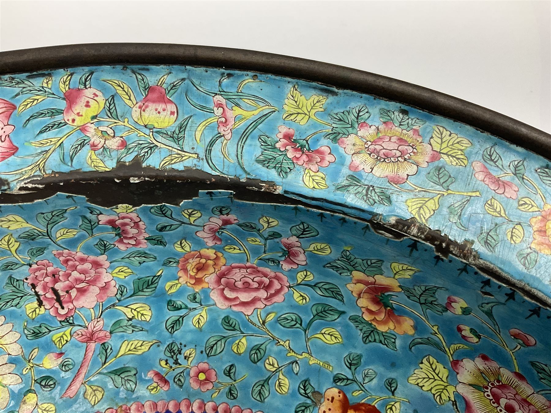 18th/19th century Chinese Canton enamel basin, the circular basin with flat everted rim, decorated with scrolling foliate and fruit decoration on a blue ground, D43cm