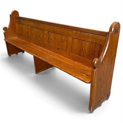 Early 20th century stained pine ecclesiastical church pew, the shaped end supports flankin...