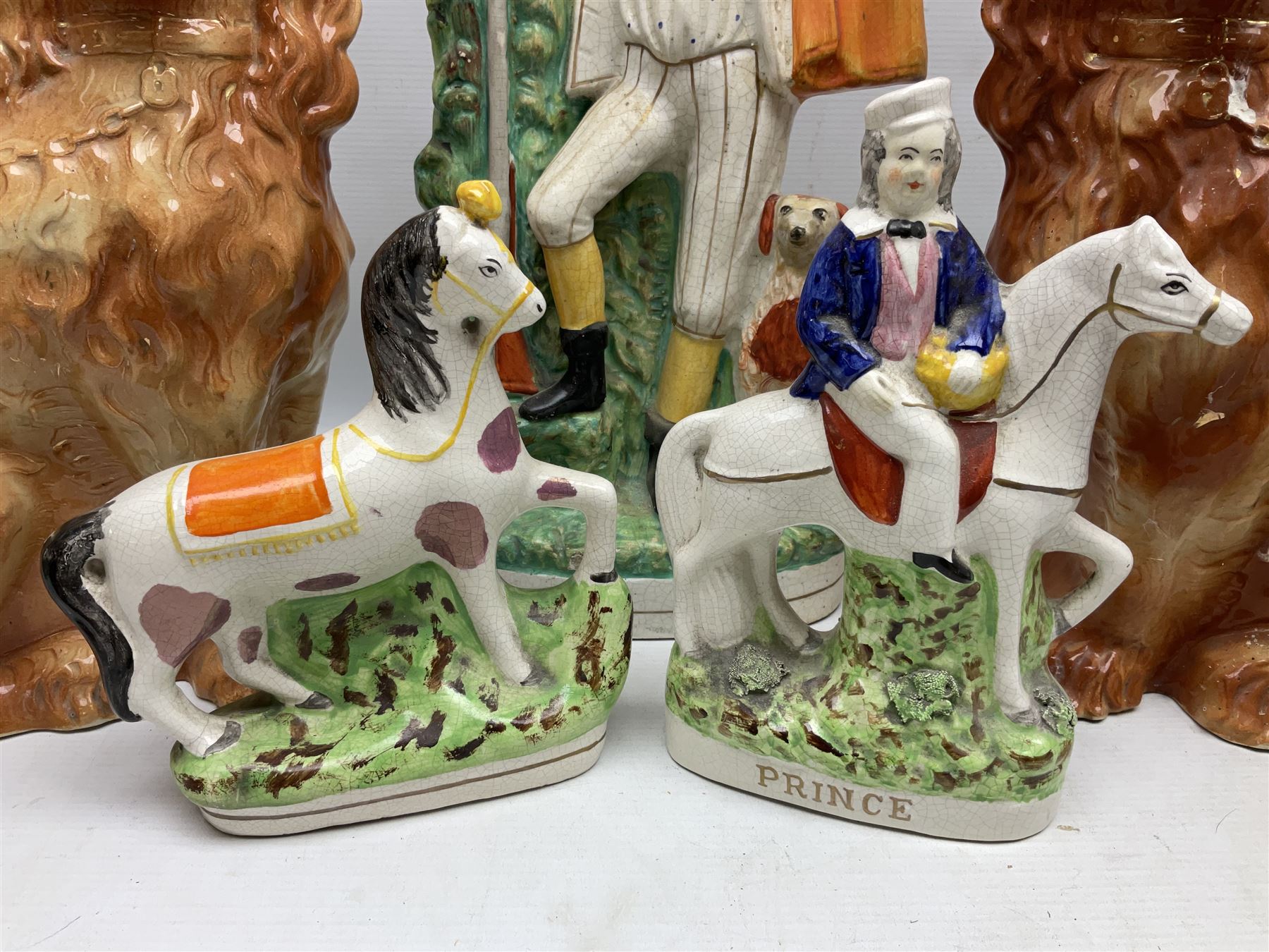 Group of Victorian and later Staffordshire style figures, to include two dogs, Prince upon horse back, horse with pink lustre patches, tall figure of a man beside his dog etc, tallest H41cm