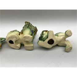 Group of four Chinese Foo dog in traditional green, blue and ochre glaze, largest 14cm