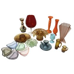 Quantity of coloured glass to include Art Deco style pink vase of fan form, orange candlestick, pin dishes, flower frog etc