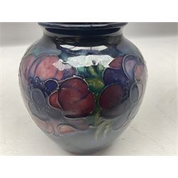 Moorcroft Anemone pattern vase of ovoid form, tube lined with large flowerheads and foliage upon cobalt blue ground, with painted and impressed marks initialled W.M beneath, H12.5cm