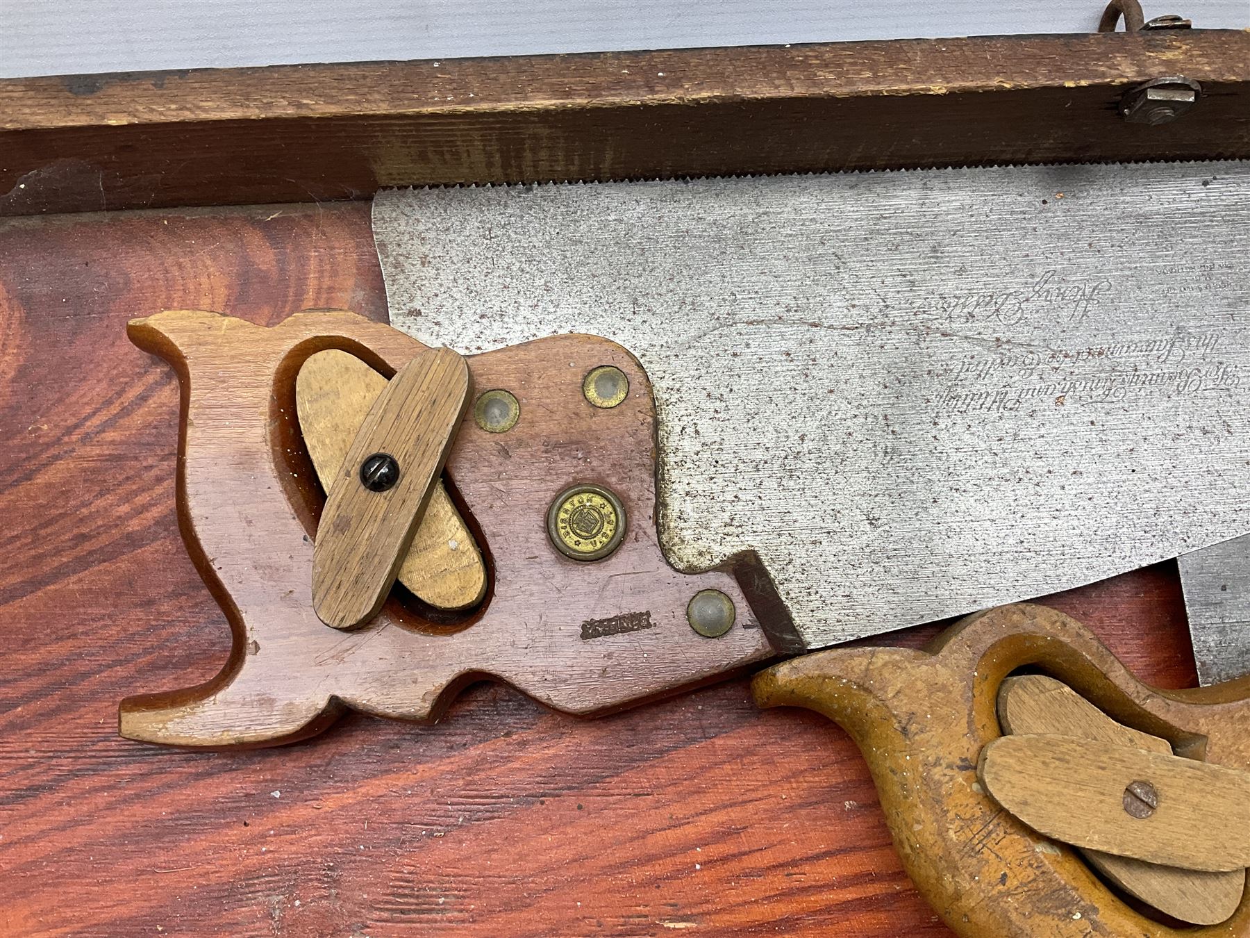 Large wooden tool box and carpenters tools, to include tenon and panel saws, box plane, mallet, chisels etc