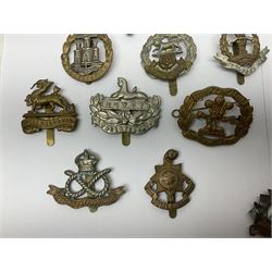 Seventeen regimental cap badges including Dorsetshire, Worcestershire, Staffordshire, Lancashire, Manchester, Middlesex, Berkshire, Bedfordshire etc (17)
