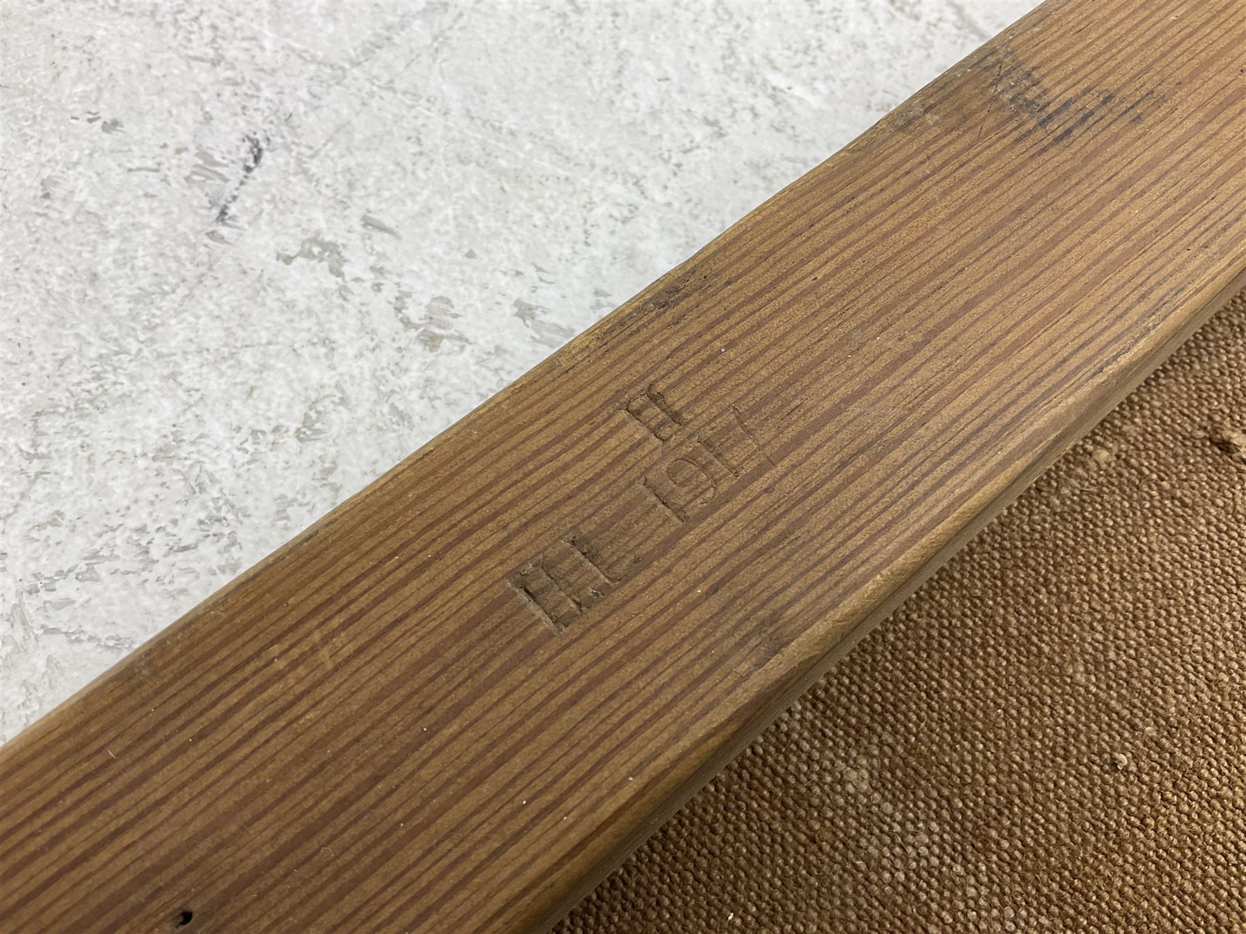 WW1 British casualty stretcher with iron mounted pitch pine sides and canvas base; stamped 'HL1917' and L7 with broad arrow in a triangle L236cm ( reputedly recovered from a barn at Bapaume on The Somme)