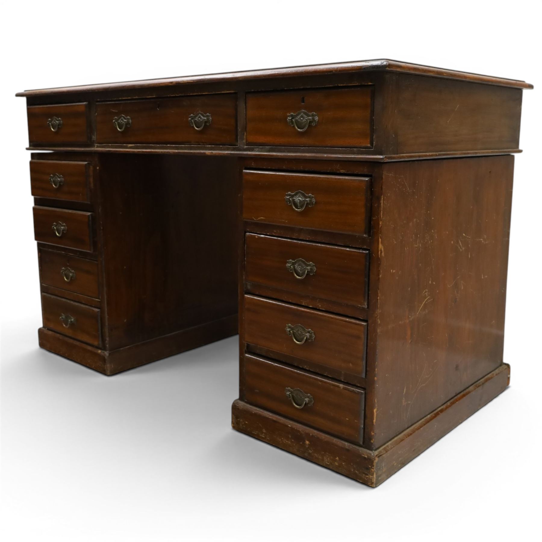 Late 19th century twin-pedestal desk, red leather inset top over an assortment of eleven drawers, on plinth base (W126cm D65cm H77cm); with Edwardian oak framed Captains swivel desk chair, of tub shaped form with spindle back supports (W60cm H89cm)