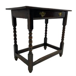 18th century oak low-boy, rectangular two-plank top over a single drawer with pressed brass handle plates, raised on bobbin-turned supports united by box stretcher