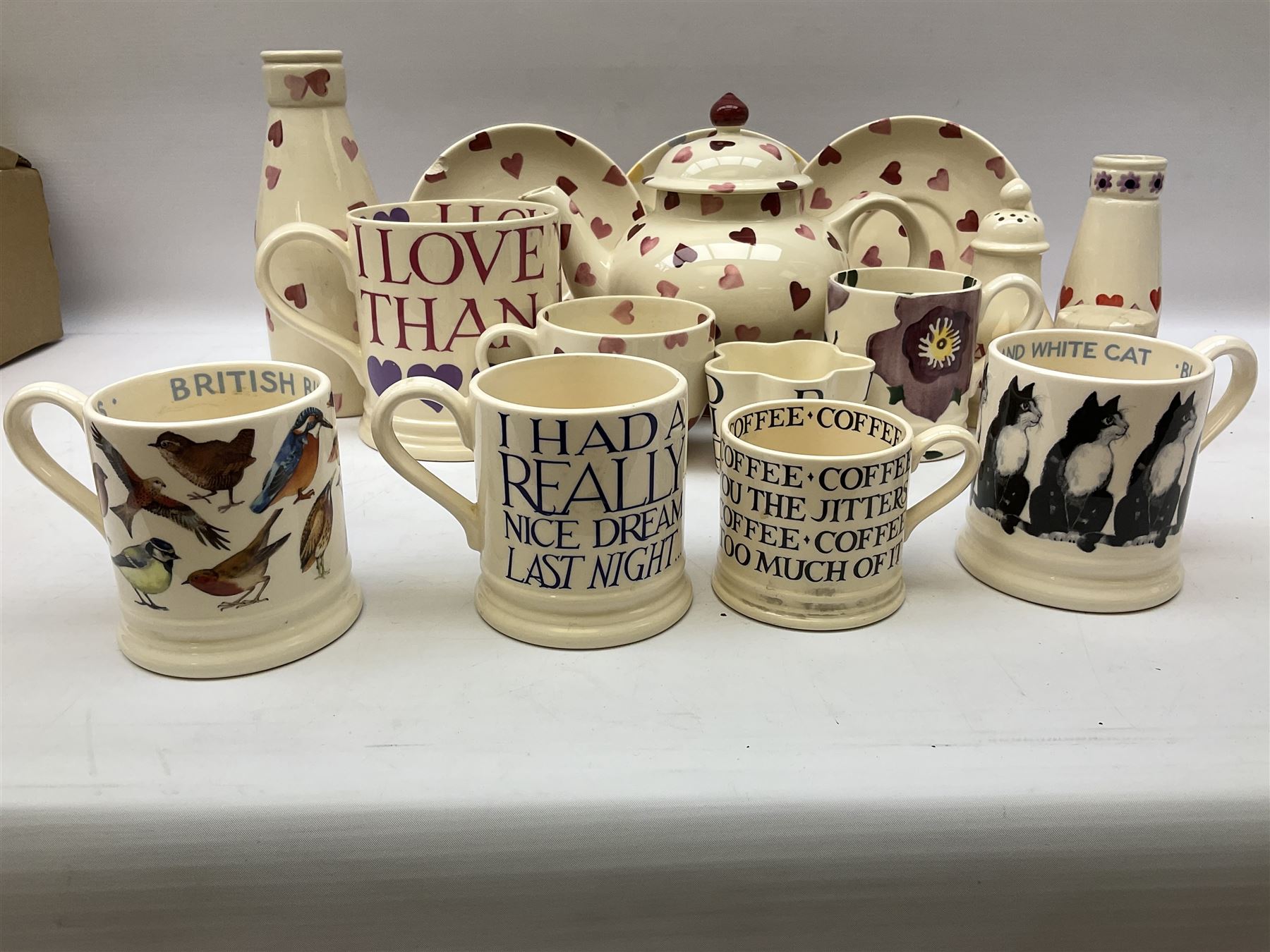 Collection of Emma Bridgewater spongeware ceramics, to include Pink Hearts pattern teapot, milk bottle vase, teacup and saucers, Love & Kisses sugar shaker and large 'I love you more than Marlon Brando' mug, British Birds and Black and White pattern mugs, etc, all with printed marks beneath, tallest H21.5cm