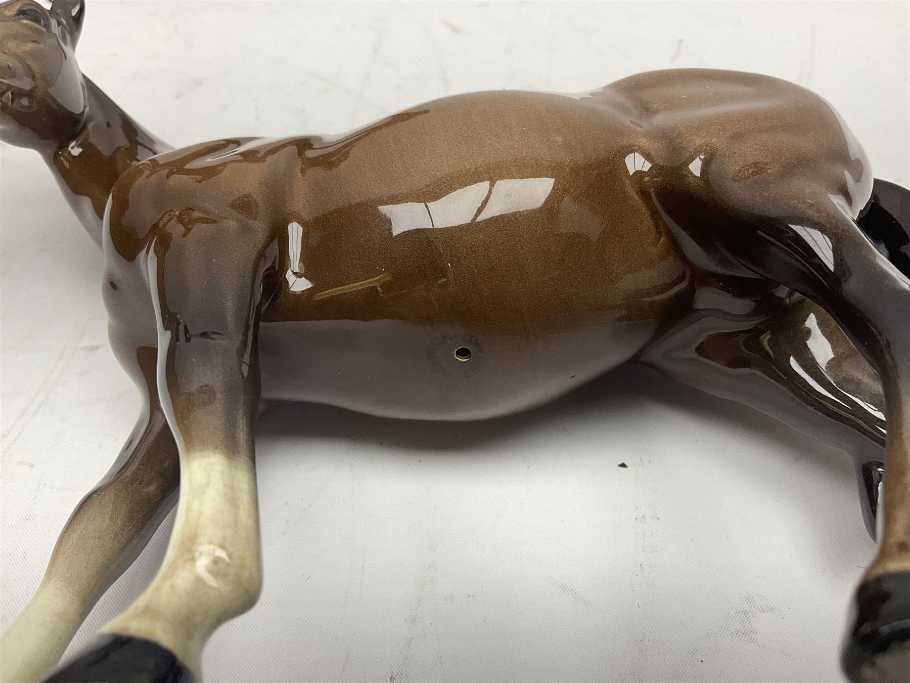 Four Beswick horses, including Exmoor no 1645, Black Beauty foal and two others 