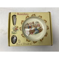 Royal Doulton Bunnykins nursery set in box and two cups, together with two Wedgwood Peter Rabbit mugs and Royal Staffordshire Noddy money box and cup (7)