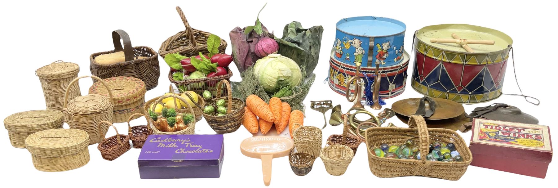 Vintage musical toys including three tin-plate drums by Chad Valley etc; two sets of cymbals; five miniature brass/copper bugles and horns; together with a quantity of vintage dolls artificial fruit and vegetables and basket ware; glass marbles etc