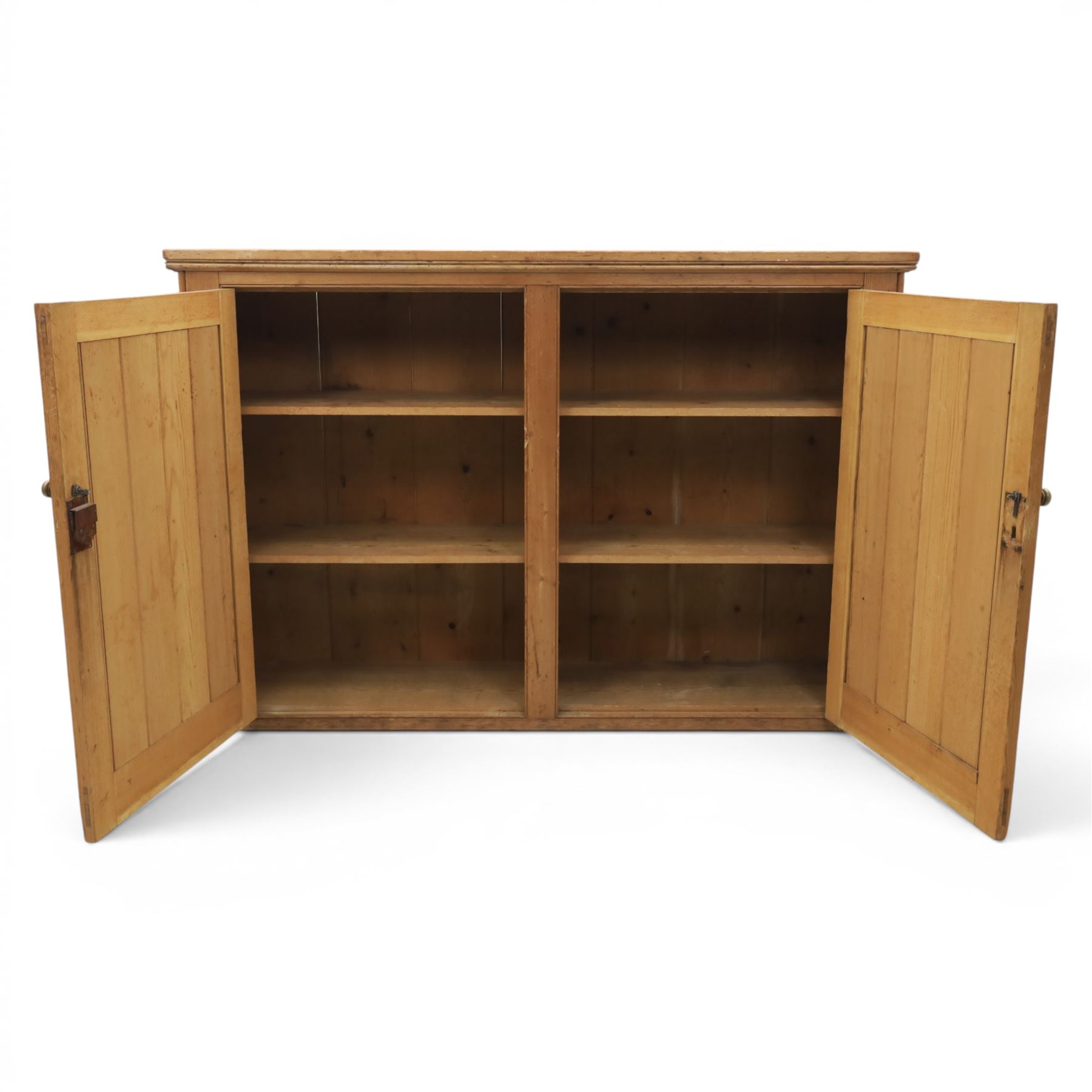 Victorian waxed pine low cupboard, fitted with two panelled doors and panelled sides, two interior shelves