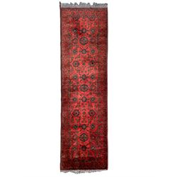 Pakistani red and blue ground runner, decorated with stylised plant motifs and trailing foliate, triple band border with stylised foliage motifs