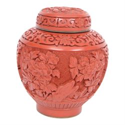 Near pair of Japanese plates, decorated in green, blue and iron-red enamels, with peacocks perched on a rock among foliage, together with Chinese cinnabar ginger jar, plates D21cm 