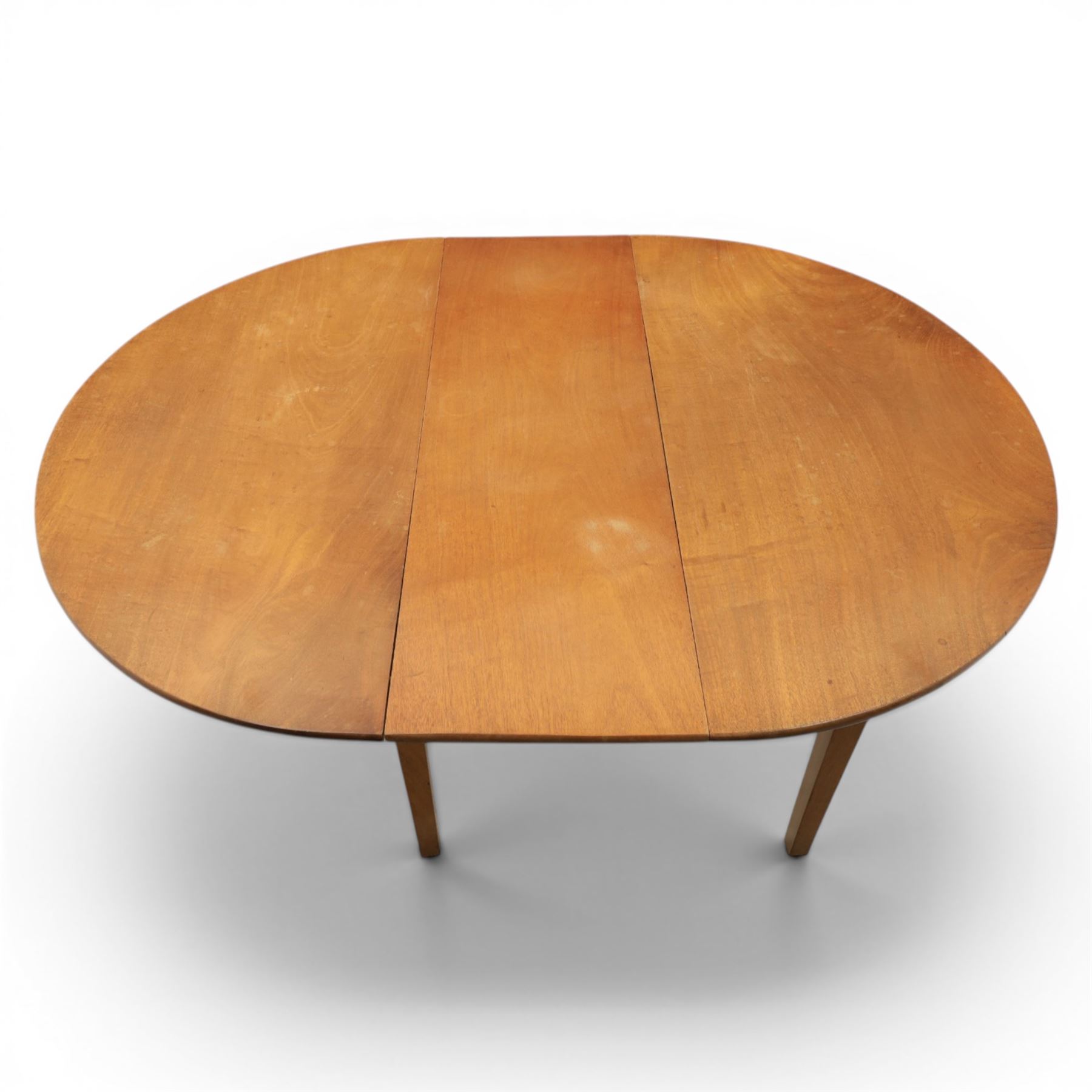 Mid 20th century teak extending dining table, together with eight teak chairs with green leather seats, extends to 154cm