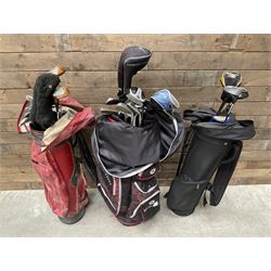Various golf clubs in three bags