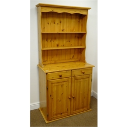  Solid pine small dresser, moulded top, two shelves above two drawers and cupboards (W85cm, H174cm, D43cm) and a pine chest, two short and four long drawers, bun feet (W80cm, H92cm, D40cm) (2)  