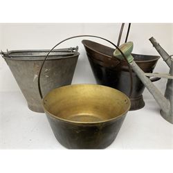 Two vintage galvanised watering cans, three galvanised buckets and a brass jam pan