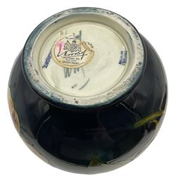 Moorcroft vase of bulaster form, decorated in Hibiscus pattern upon a green ground, H21cm 