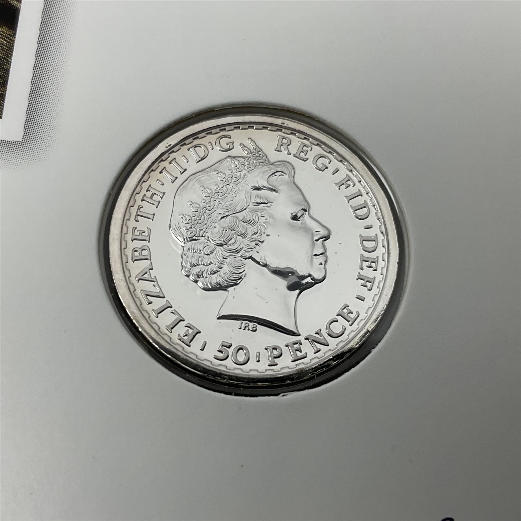 The Royal Mint United Kingdom 2014 'SS Gairsoppa Britannia' fine silver quarter ounce coin in card folder and 2015 'Britannia' fine silver fifty pound coin on card