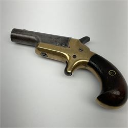 Colt .41 calibre rim-fire third model deringer with 6.5cm barrel marked COLT, brass frame stamped .41cal with C and rampant colt mark, sheath trigger and two-piece varnished wooden grips L13.5cm overall; with one inert cartridge
