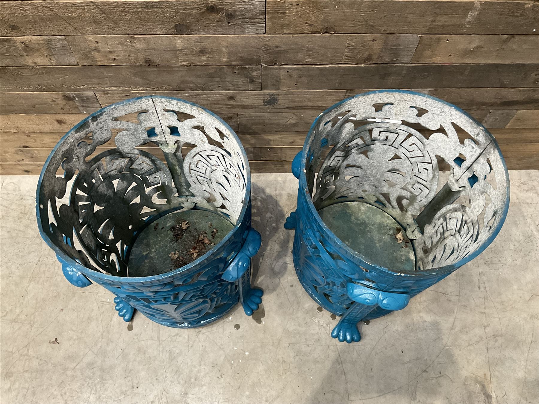 Pair of blue painted cast iron garden bins