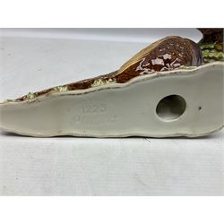 Three Beswick figures of birds, comprising pheasant no 1225, magpie no 2305 and woodpecker 1218, all with impressed marks beneath, tallest H22cm