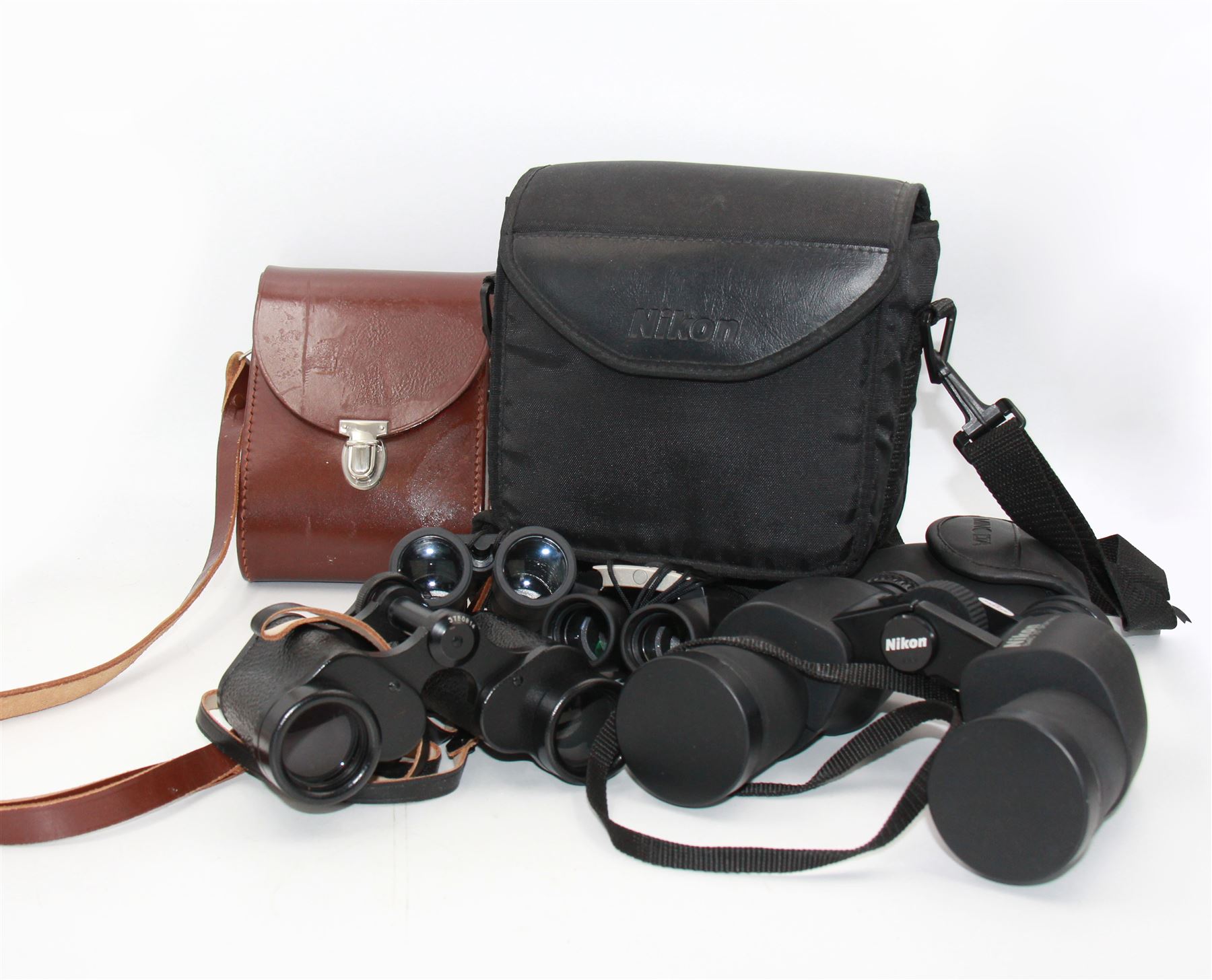 Four pairs of binoculars, to include Carl Zeiss Jena Jenoptem 8x30W serial no. 3750814, Nikon Sporting II 8x40 serial no. 604672, Minolta Pocket II 8x22 Field 7 and Jessops 12x25 Field 4.8 84m/1000m, all in carrying cases 