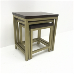  Nest of three tables, walnut top, gold finish supports, W46cm, H52cm, D36cm  