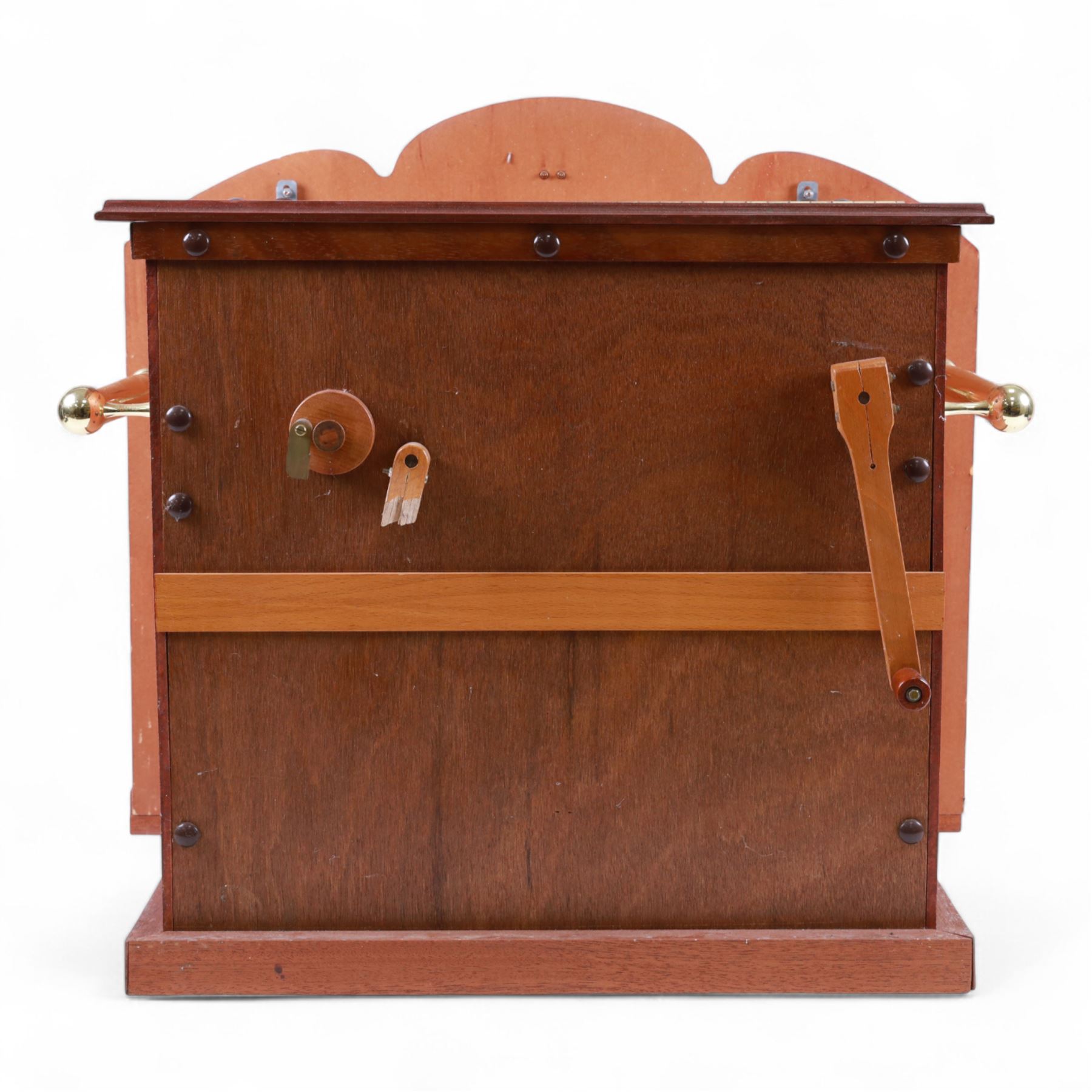 John Smith-20th century hand cranked portable street organ “music and mirth” in a wooden case with carrying handles, with speaking pipes and mannequin to the front. All pipes present, however the mechanism is in need of restoration. With five paper music rolls.