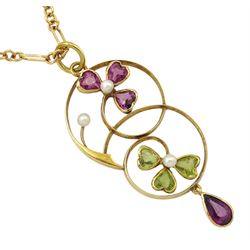 Edwardian gold peridot, garnet and pearl three leaf clover pendant, stamped 15ct, on later 9ct gold Figaro link necklace chain, London import mark 1989